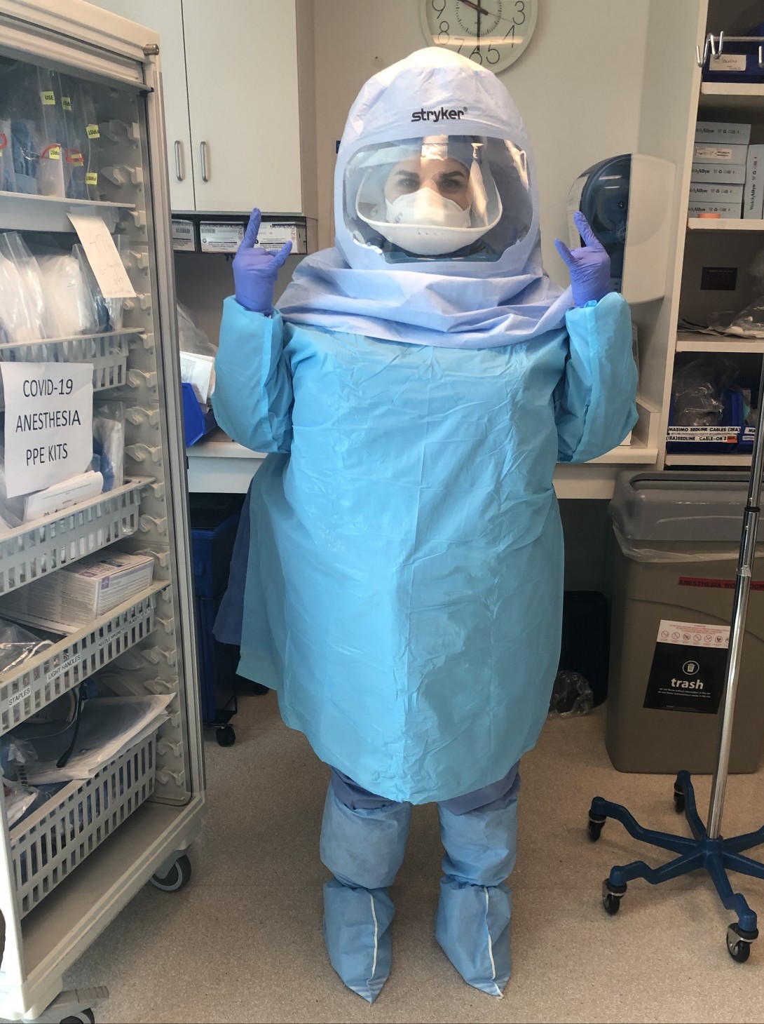 Woman wearing full-body blue protective gear 