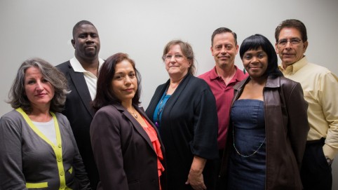 Charitable Health Coverage. L-R: Bilingual Enrollment Processor Miriam Garcia, OPEIU LU 29; Enrollment Processor/Union Steward Carl Artis, OPEIU LU 29; Enrollment Processor Arsenia Alonso, OPEIU LU 29; Systems Manager Susan Davis, Management; Systems Administrator William Bilbrey, Management; Enrollment Processor Sharlene Jone, OPEIU LU 29; National Operations Manager Maurice Rosas, Management.