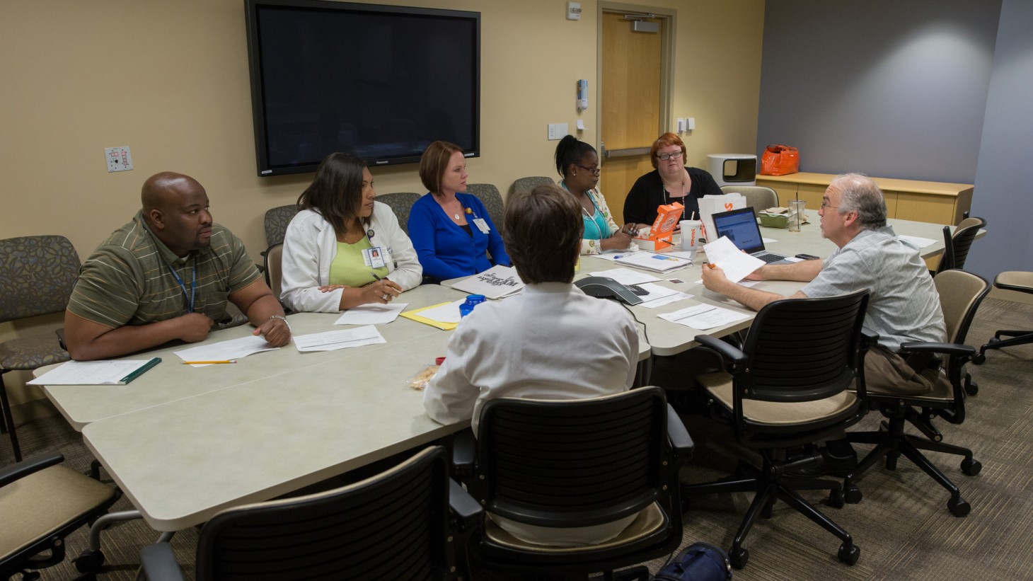 people meeting around a conference table 