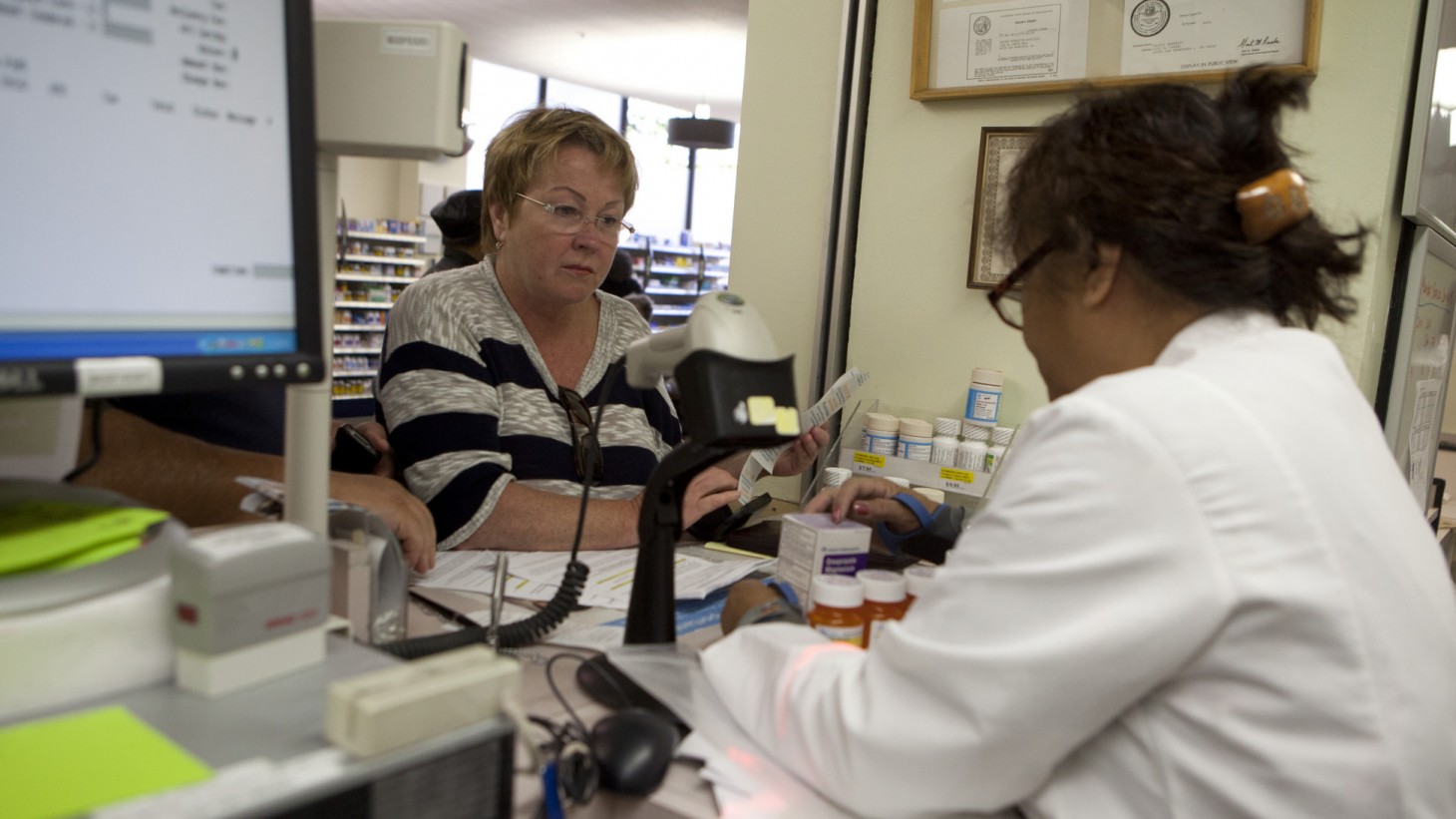 Pharmacy tech speaks with patient.